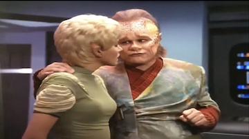 Neelix explains black holes to Kes.  He says that an event horizon is a "very powerful energy field."